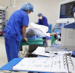 Patient Surgical Chart In Foreground In Or High Res Stock Photo Getty