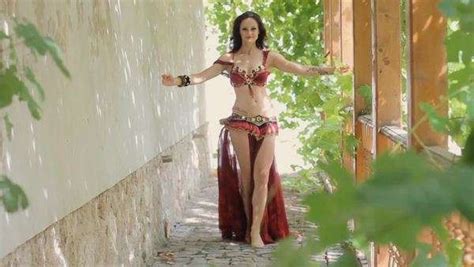 Feminine Barefoot Woman With Mehndi Talently Dancing Belly Dance