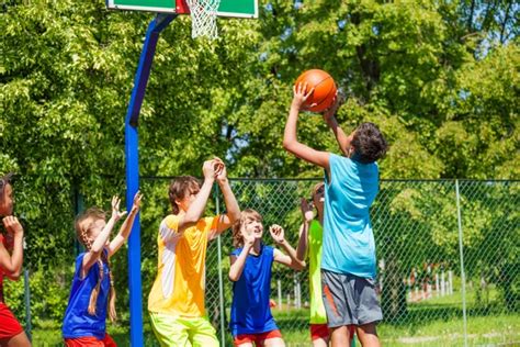 Teenagers Playing Basketball Game Together — Stock Photo © Serrnovik