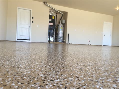 The epoxy paint used on floors, such as a garage floor epoxy coating, differs from traditional paints. Epoxy Floor Coating A Garage In Eagle Idaho