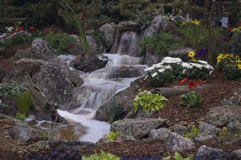 Colorado Moss Rock Mulch And Beautiful Plants Turn This Hillside Into