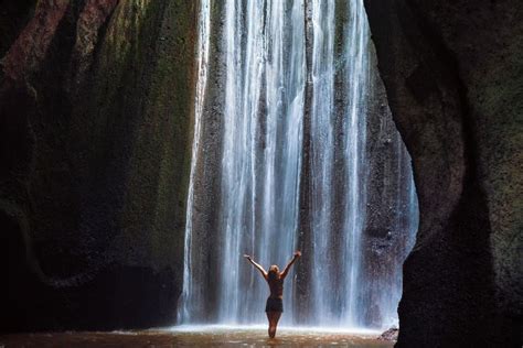 Woman Stand Under Cave Waterfall High Quality People Images