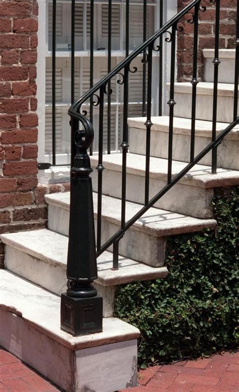 Wrought iron banister rail wall support hand railings for stairs. Iron railings at Mary Marshall Row, 230-244 E. Oglethorpe ...
