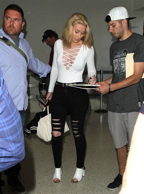 Iggy Azalea Goes Braless In Lace Up Bodysuit And White Mules