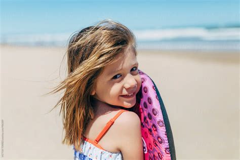 Portrait Of An Adorable Little Girl At Beach By Stocksy Contributor