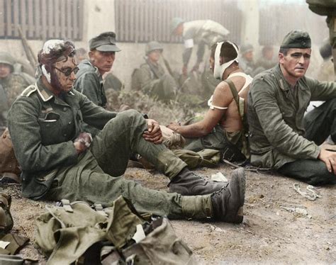 Wounded German Soldiers Taken As Pows By American Troops During