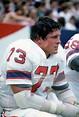 John Hannah #73 of the New England Patriots looks on from the bench ...