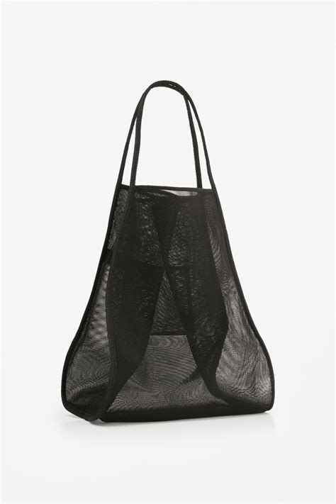 Made From A Technical Mesh Material This Large Tote Bag Has A Small