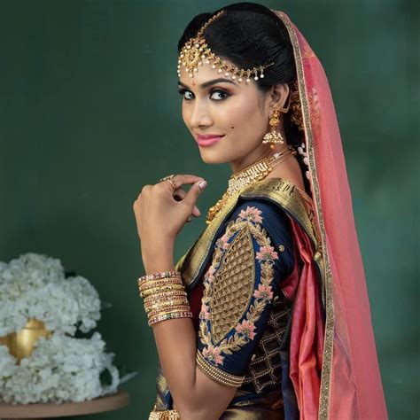 In A Bridal Look In Pink Rose Color Pattu Kanjeevaram Saree Elbow Length Sleeve Blouse