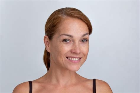 premium photo portrait of smiling middle aged woman looking at camera