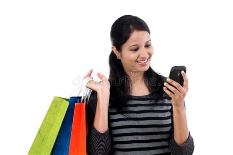 Young Woman Looking Mobile Phone And Shopping Bags Stock Image Image
