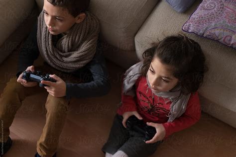 Siblings Playing Video Game At Home Stock Image Everypixel