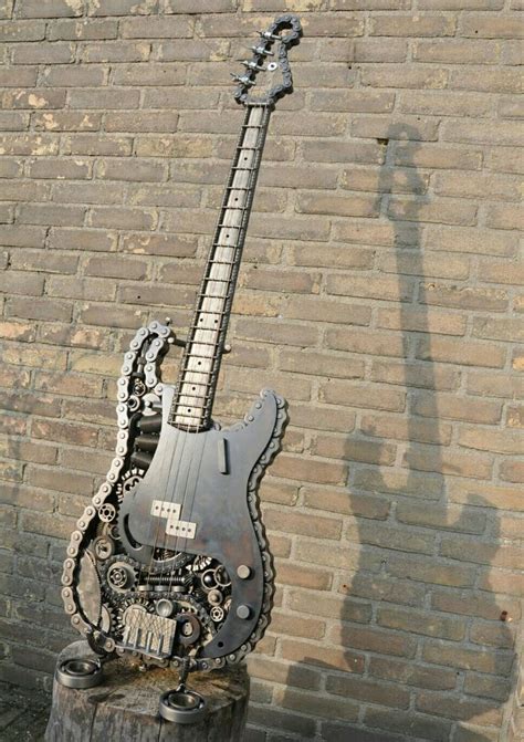 An Electric Guitar Sitting On Top Of A Tree Stump In Front Of A Brick Wall