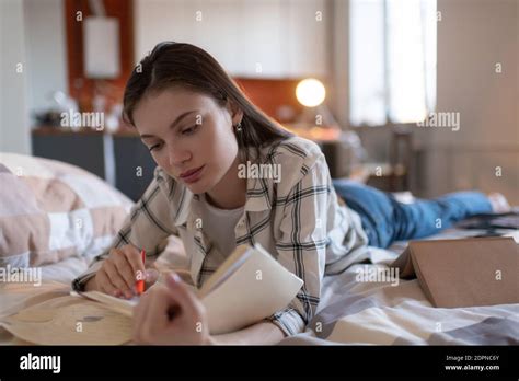 Beautiful Focused Teenage Female Student Studying Notes Preparing For