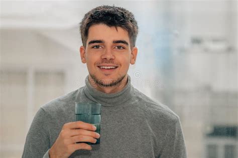 Man Drinking A Glass Of Water Stock Photo Image Of Drinking Indoor