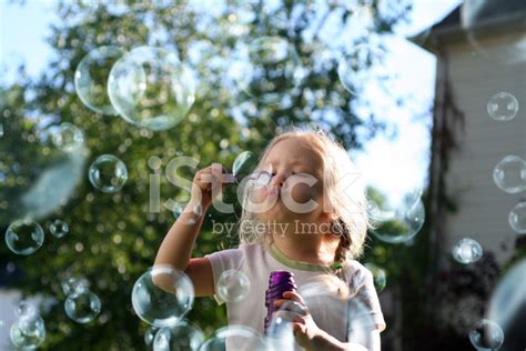 Little Girl Blowing Bubbles Stock Photo Royalty Free Freeimages