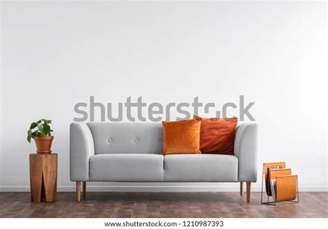 Comfortable Couch With Orange And Red Pillow In Spacious Living Room Interior Real Photo With
