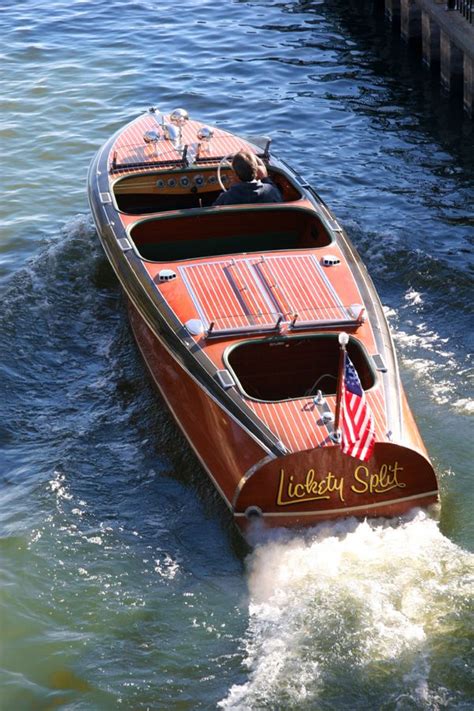 A Small Wooden Boat With An American Flag On It