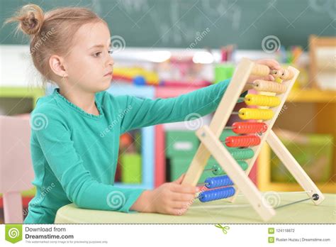 Little Girl Sitting And Counting On Abacus Stock Photo Image Of