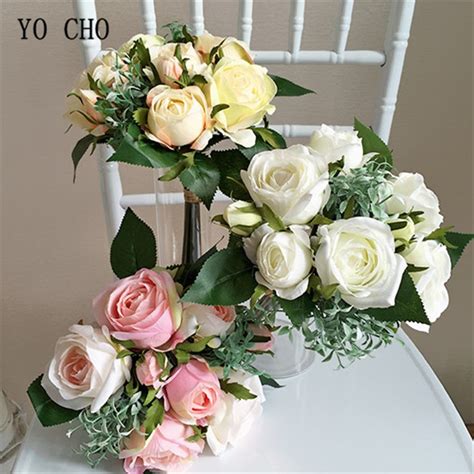 yo cho bridesmaid sisters holding ivory rose peony bouquet artificial