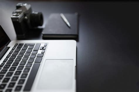 Grayscale Photography Of Laptop Computer Beside Book And Camera · Free