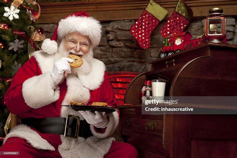Pictures Of Real Santa Claus Enjoying Milk And Cookies High Res Stock