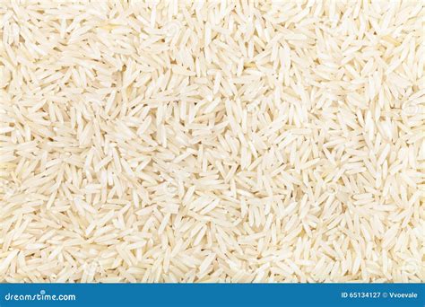 Basmati Rice Groats In Wooden Bowl Isolated On White Background Top
