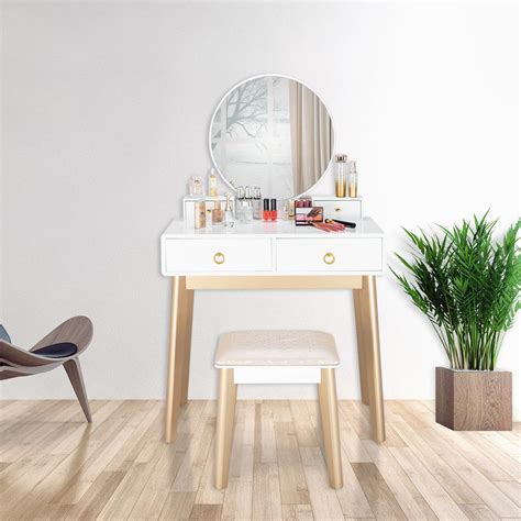 This also includes five drawers for storage and a matching stool covered in a solid color fabric. Winado Vanity Table Set with Round Mirror for Bedroom ...