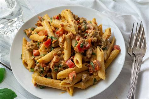 creamy italian sausage and tomato pasta foodtasia