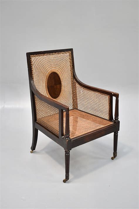 Mahogany And Cane Armchair With Suspended Oval Back The Classic Prop
