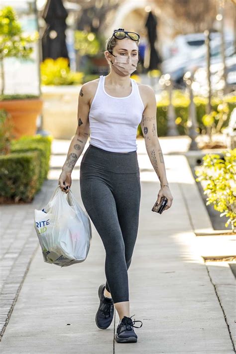Miley Cyrus In A White Tank Top Steps Out For Some Essentials At Her Local Drug Store In