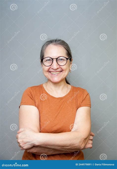 portrait of 60 year old woman on gray background stock image image of smile hair 244979891