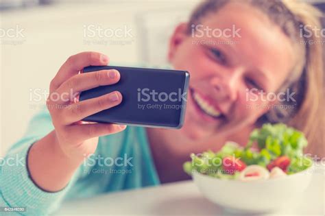 Teenage Girl Taking A Silly Selfie With Food Stock Photo Download