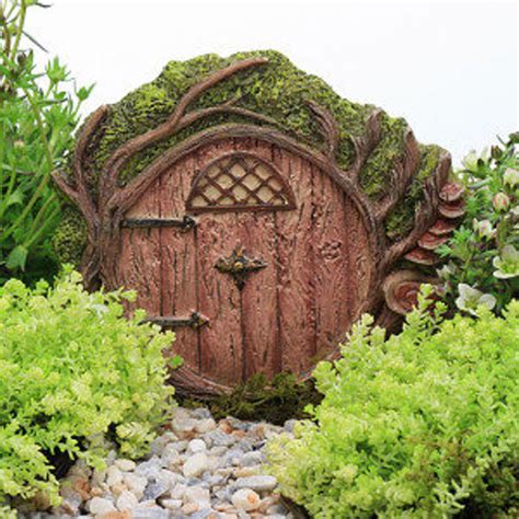 A Fairy Door In The Middle Of Some Plants