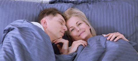 Couple In Bed Man And Woman Are Enjoying Spending Time Together While