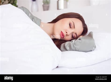 Portrait Of Attractive Calm Girl Lying In Bed Sleeping Sweet Dream At Home House Light White