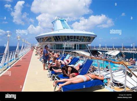 Passengers Relaxing On Board The Cruise Ship Discovery That Belongs To