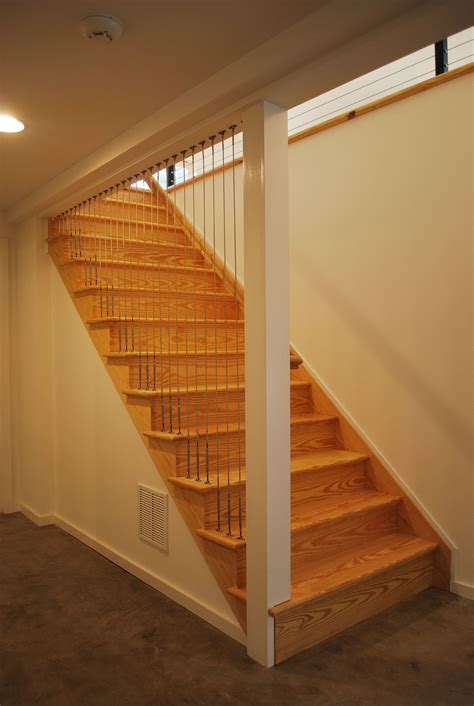 Natural Stain Staircase With Metal Cable Rail Railing For An Ultra
