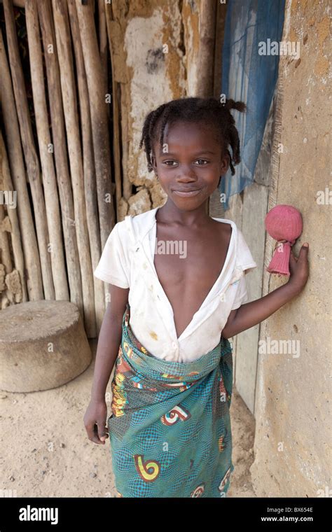 A Young Girl Stands Outside Her House In Kakata Liberia West Africa