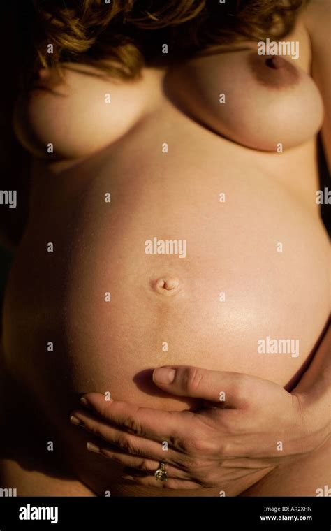 Nude Pregnant Woman Holding Her Belly Stock Photo Alamy