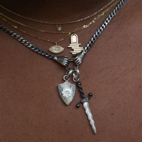 Wavy Dagger Pendant Fiat Lux