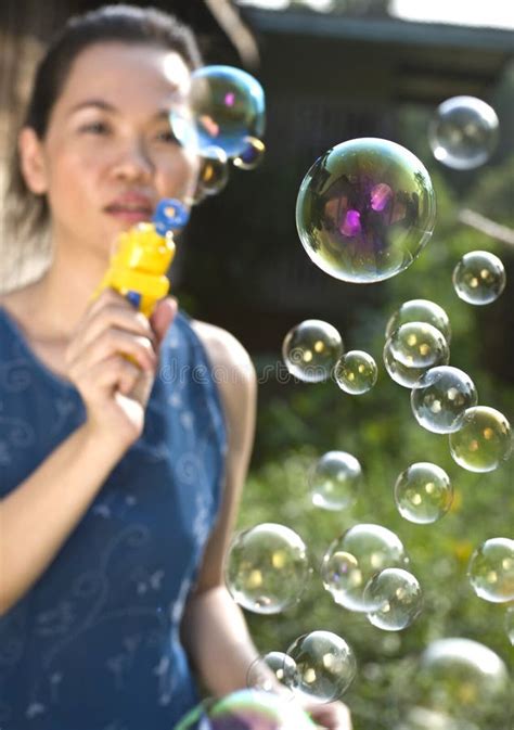 Young Woman Blowing Soap Bubbles Stock Image Image Of Adorable