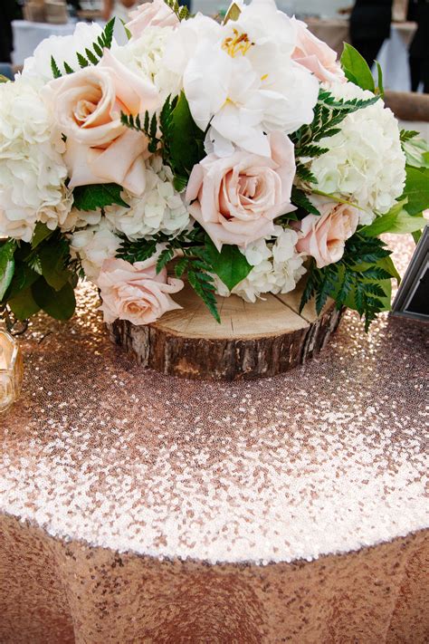 Rustic Wedding Centerpiece On Glitter Rose Gold Tablecloth Photographed