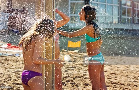 Girls Taking A Shower At The Beach On A Sunny Day Photo Getty Images
