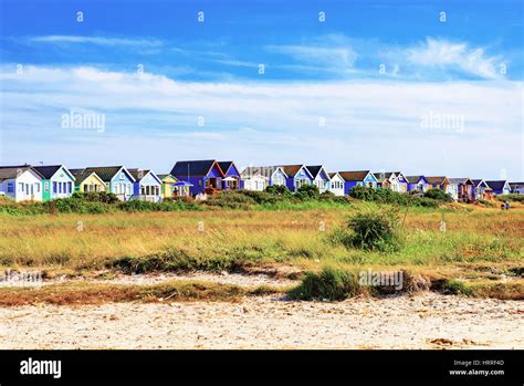 Colorful Beach Huts With Blue Sky And Grassland Stock Photo Alamy