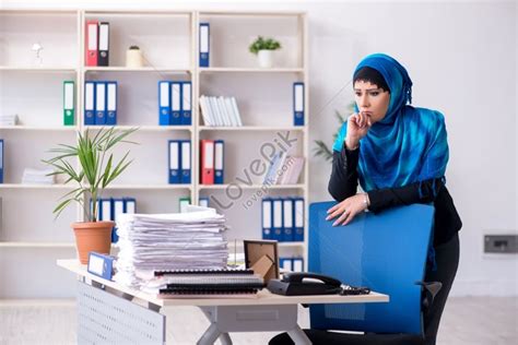 the female employee in hijab working in the office female employee in hijab working in the