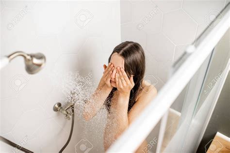 Young And Beautiful Woman Washing Her Face Taking A Shower In The
