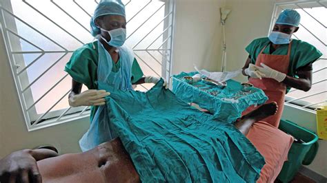 preparing a patient for circumcision in uganda the new humanitarian