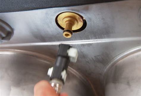 The longer flexible line goes up through the faucet arch and is connected to the pull out head. Installing a Kitchen Faucet and Side Sprayer at The Home Depot