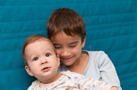Portrait Of Older And Younger Brothers Stock Photo Image Of Beige